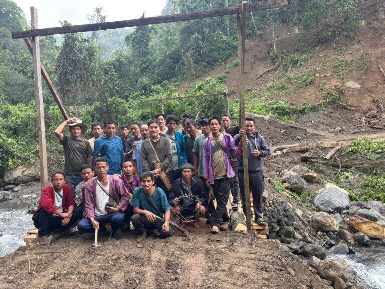 Community rebuilds log bridge over Ribung river in Siang district