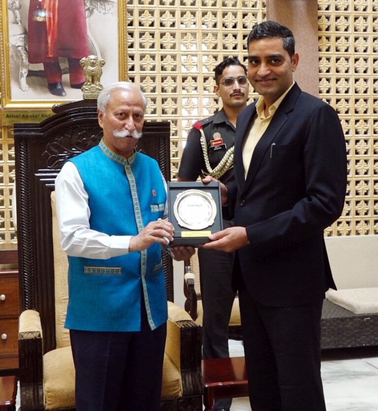 Guv presents ‘Land of Rising Sun Plaque for Excellence’ to Pawan Kumar Sain